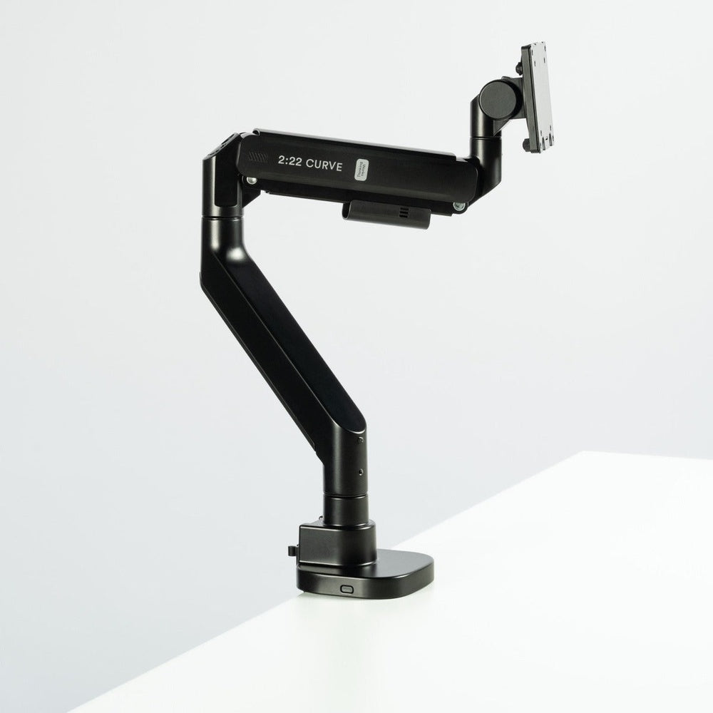 Thinking Works 2:22 Curve single monitor arm in matte black with a monitor fitted, front three-quarter view
