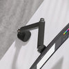Top-down view of a workstation using the Thinking Works 2:22 Curve monitor arms, showing cable management